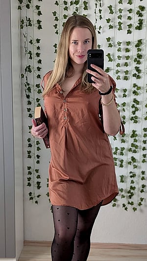 Braless German Librarian Teases With a Playful Peak
