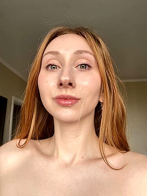 Red-haired babe is always happy to have cum on her face'